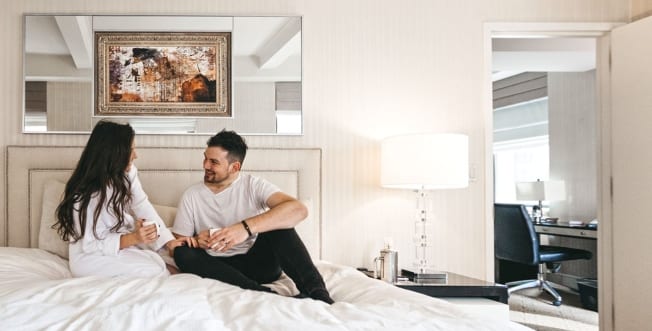 A young couple in a signature suite at The Benjamin Hotel in New York