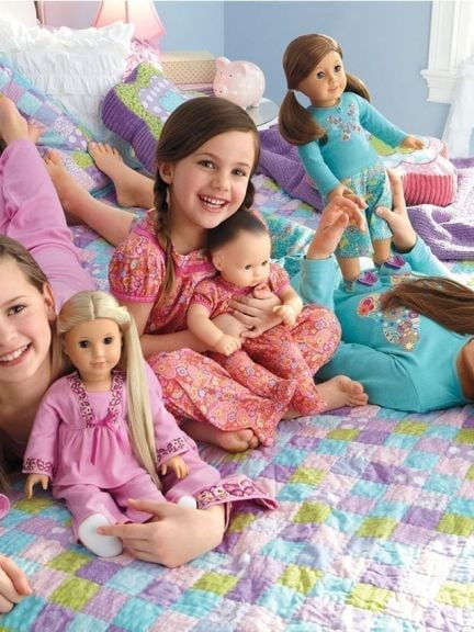 Three girls with American Girl Dolls